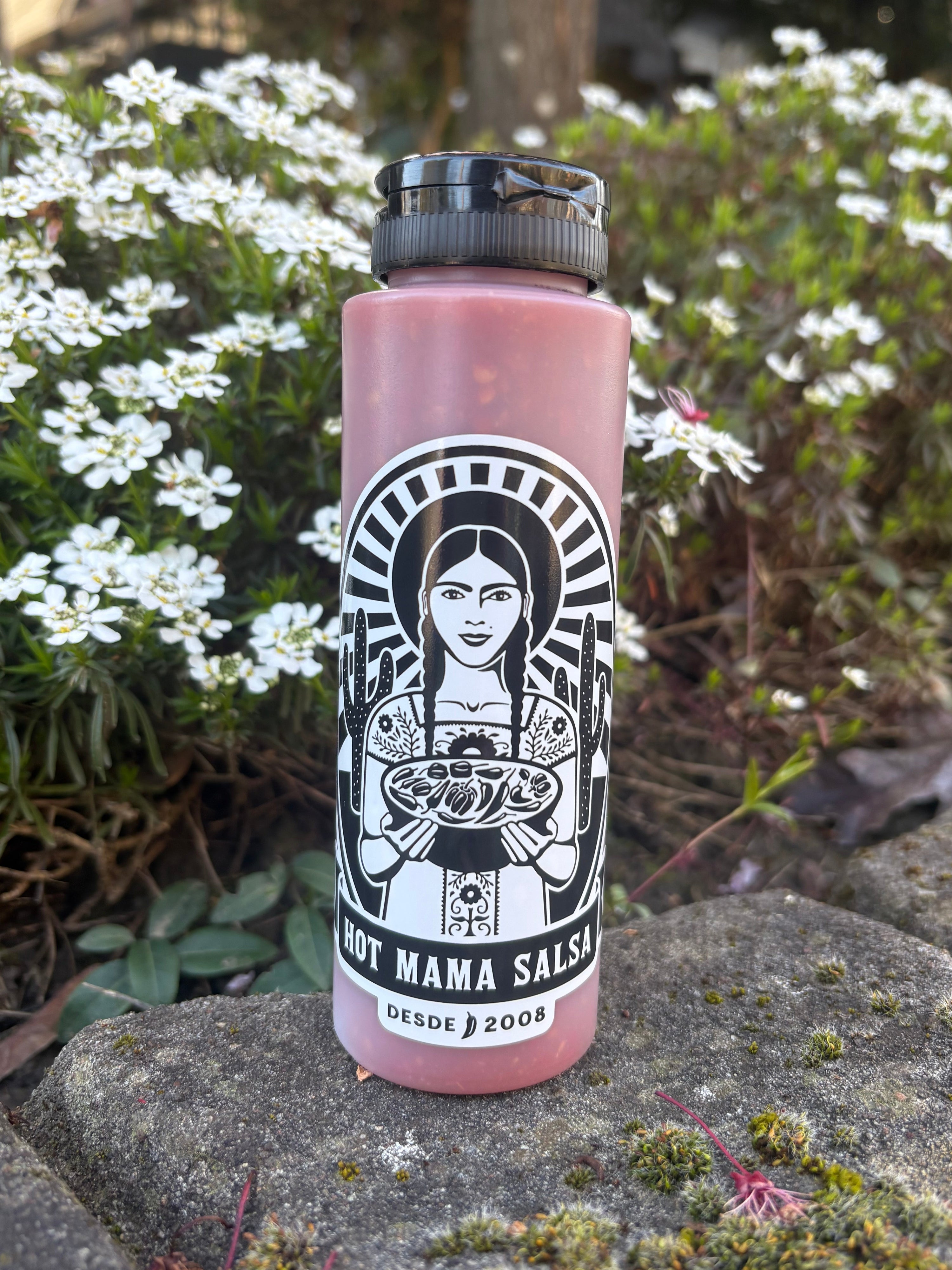 Bottle with a label featuring a face design on a natural background